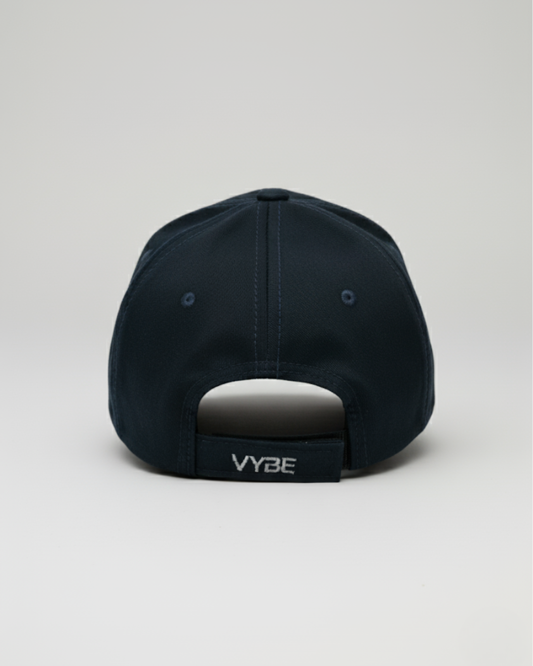 VYBE cap in Oceano – deep blue performance cap with minimalist VYBE logo